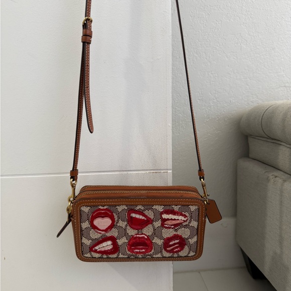 Coach Handbags - Coach Brown and Red Crossbody Bag with Lip Design